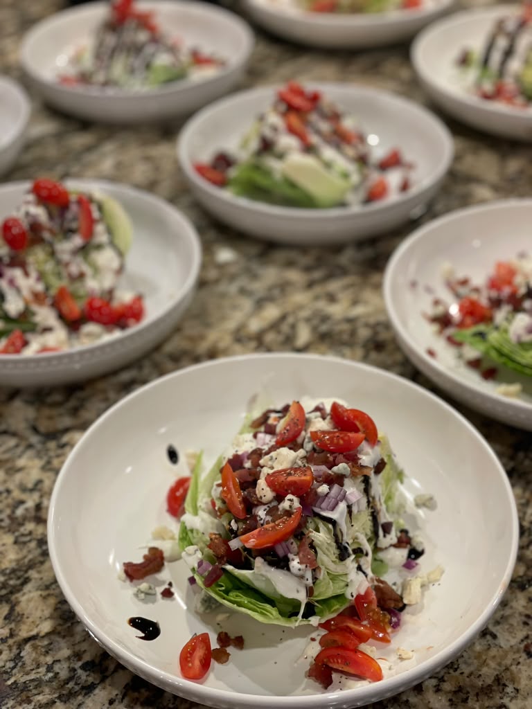 Individual wedge salads with bacon, tomato, blue cheese and balsamic